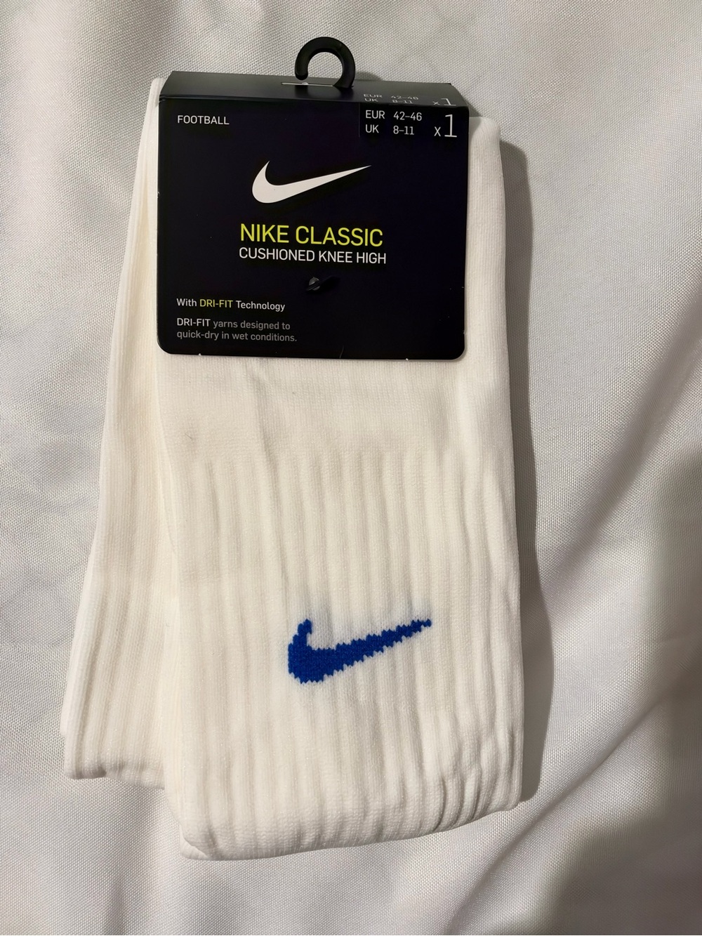 Nike White Knee High Athletic Socks with Blue Swoosh